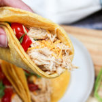Holding a chicken taco