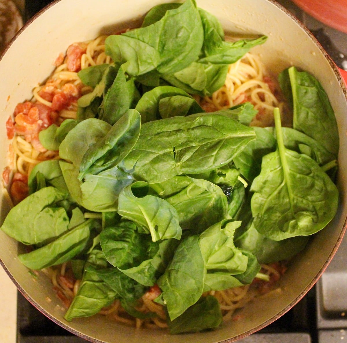 pasta in a pot with spinach