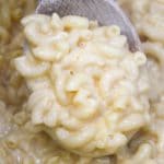 mac and cheese on a wooden spoon