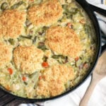 Creamy turkey shredded and baked with biscuits in a cast iron baking dish