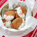gingerbread cookied dipped in white chocolate in a cookie tin