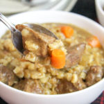 White bowls filled with beef and barley stew