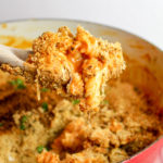 Pasta, chicken and sauce Scooped from a red pot