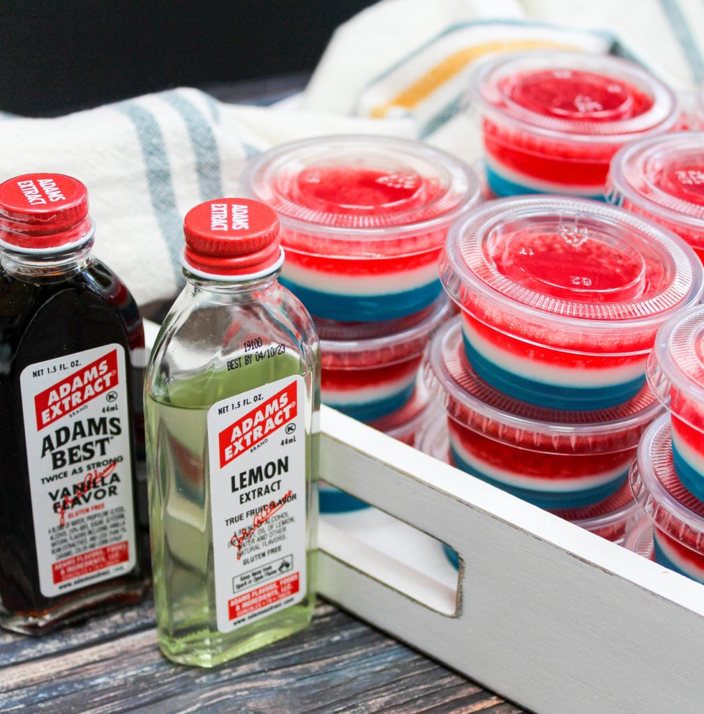 red white and blue jello shots in plastic containers