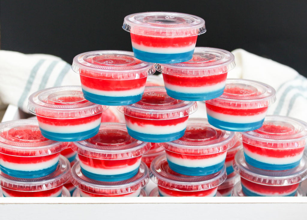 red white and blue jello shots in plastic containers