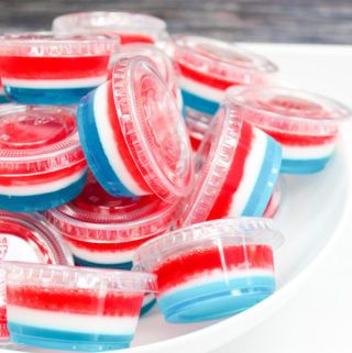 red white and blue jello shots in plastic containers