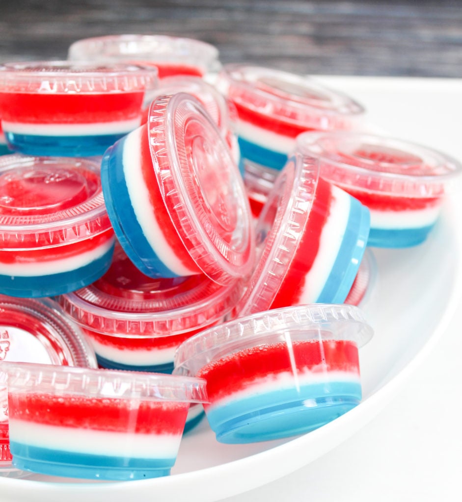 red white and blue jello shots in plastic containers