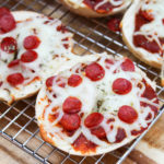 pizza bagels on a cooling rack