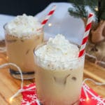 Eggnog white Russian in a glass with whipped cream