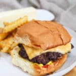 burger on a plate with fries