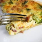 bacon broccoli quiche cut with a fork