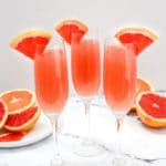 rose mimosas garnished with grapefruit slices