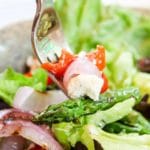 grilled asparagus salad on a fork