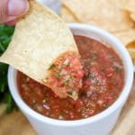 tortilla chip dipped in blender salsa