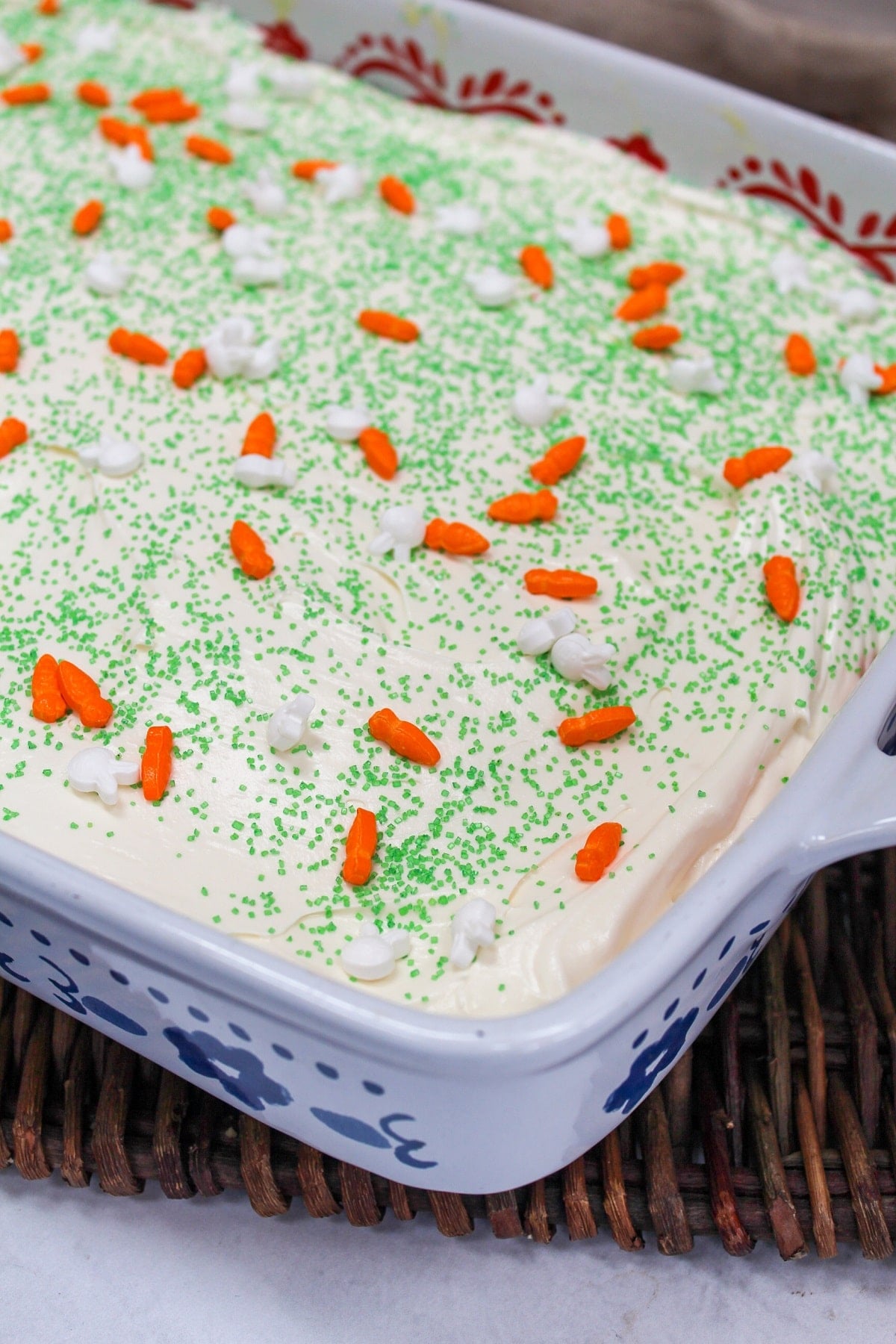 side view of carrot cake poke cake unsliced and in baking dish