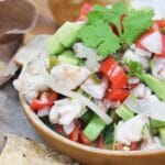 shrimp cheviche in a bowl with tortilla chips on the side