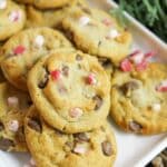 mini chocolate chip cookies with peppermint on a white plate.