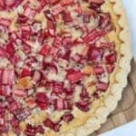 Rhubarb baked in a pie crust. Overhead picture of uncut pie.